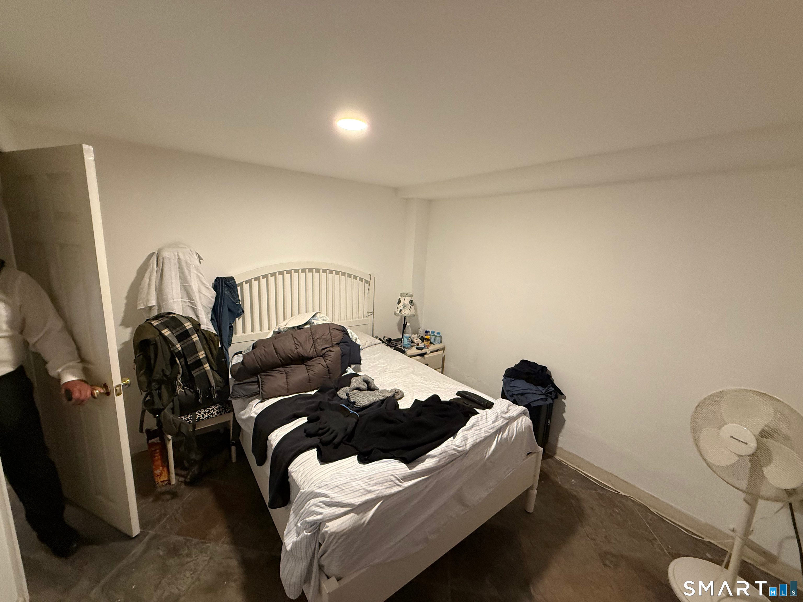 10 Purdy Road Norwalk, CT 06850 - Photo 18 of 21 a bedroom with a bed and a mirror