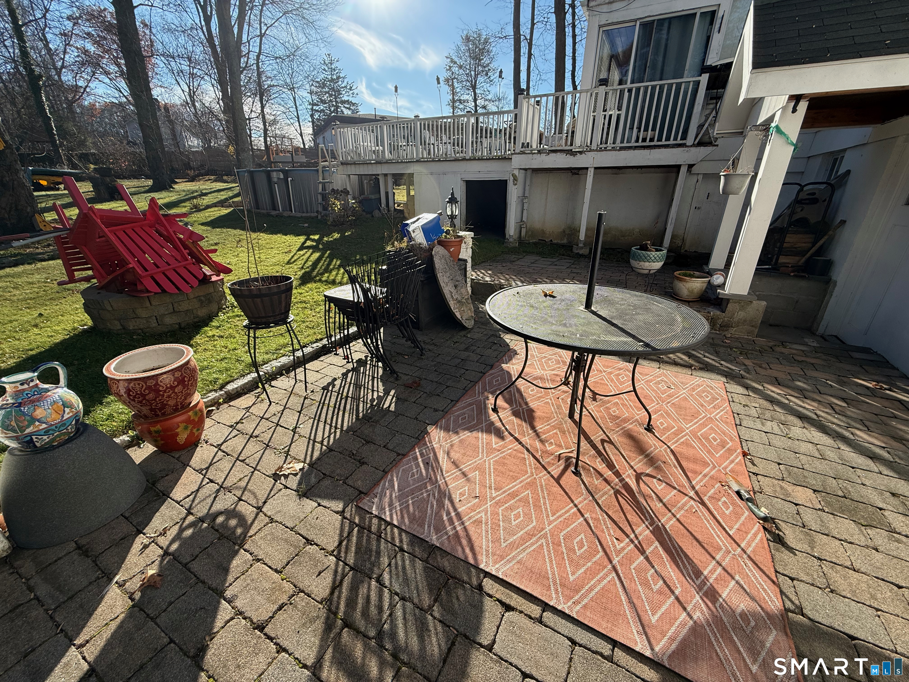 10 Purdy Road Norwalk, CT 06850 - Photo 5 of 21 a view of a patio with table and chairs with wooden floor and fence