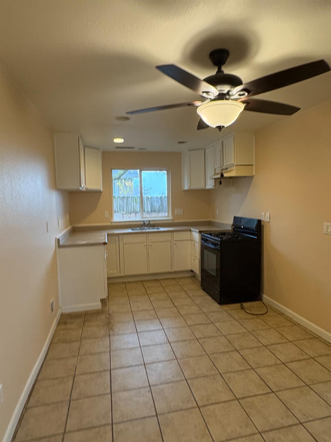 4654 Powerline Road Olivehurst, CA 95961 - Photo 8 of 14 a kitchen with a cabinets and window