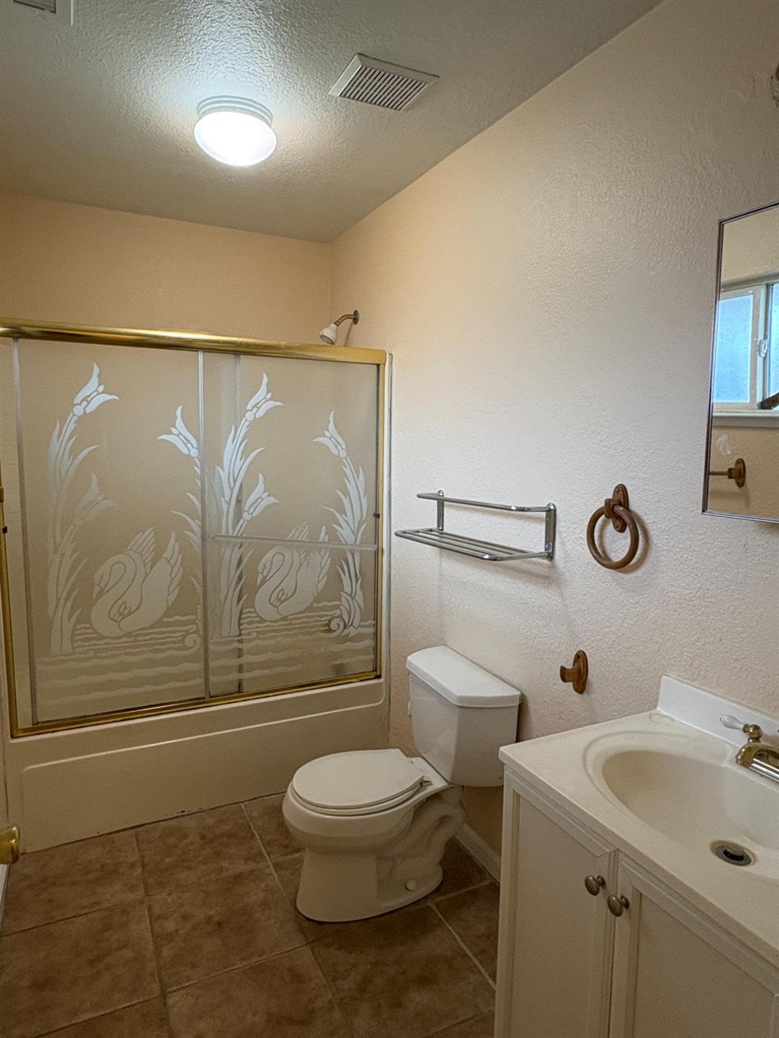 4654 Powerline Road Olivehurst, CA 95961 - Photo 9 of 14 a bathroom with a sink a toilet and shower