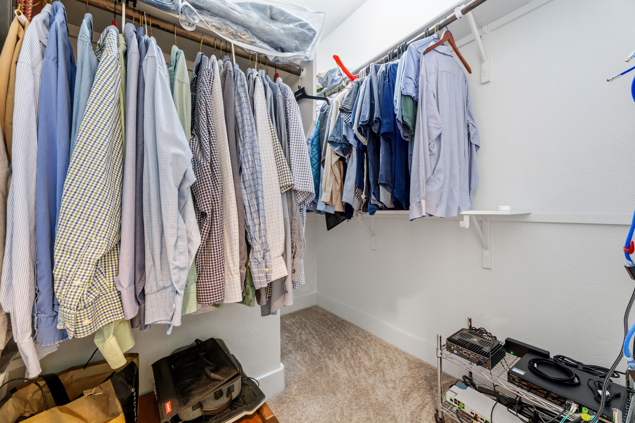 1007 Totis Road Austin, TX 78748 - Photo 24 of 37 a view of walk in closet with clothes and shoes
