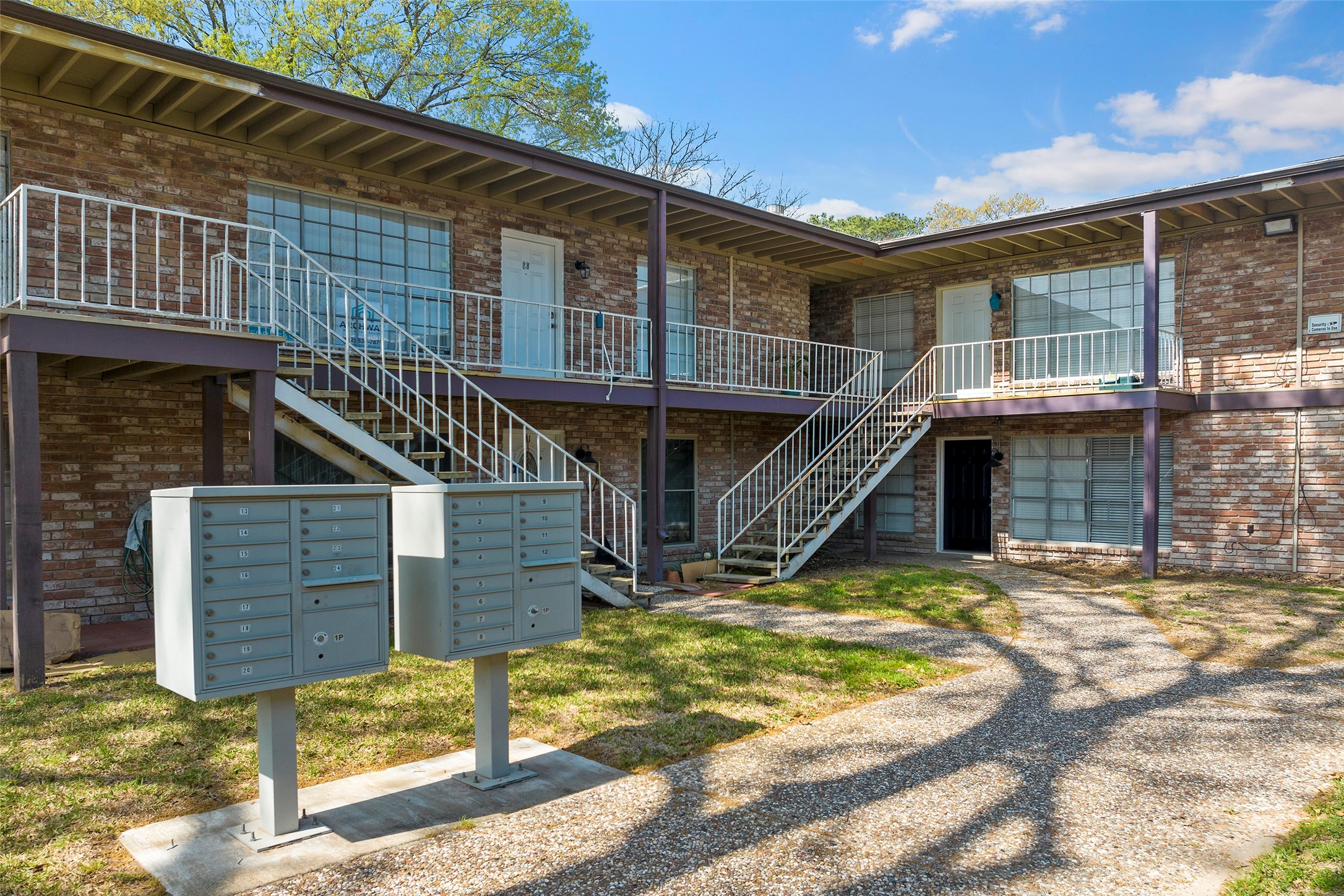 7510 Shadyvilla Lane, Unit 23 Houston, TX 77055 - Photo 3 of 23 a view of a house with wooden stairs
