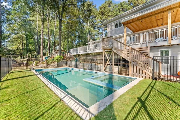 swimming pool with a outdoor seating