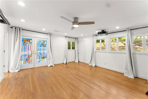 a kitchen with a refrigerator and a stove top oven