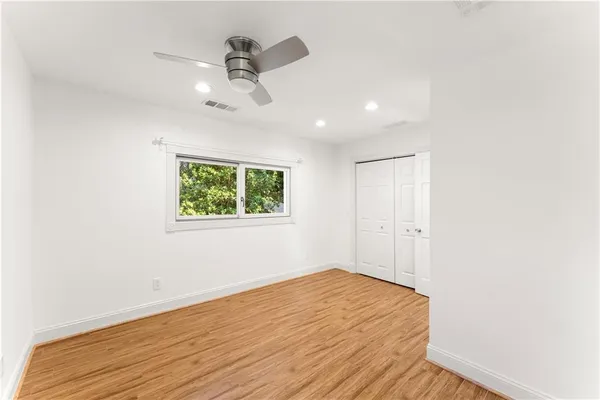 a living room with furniture and large windows
