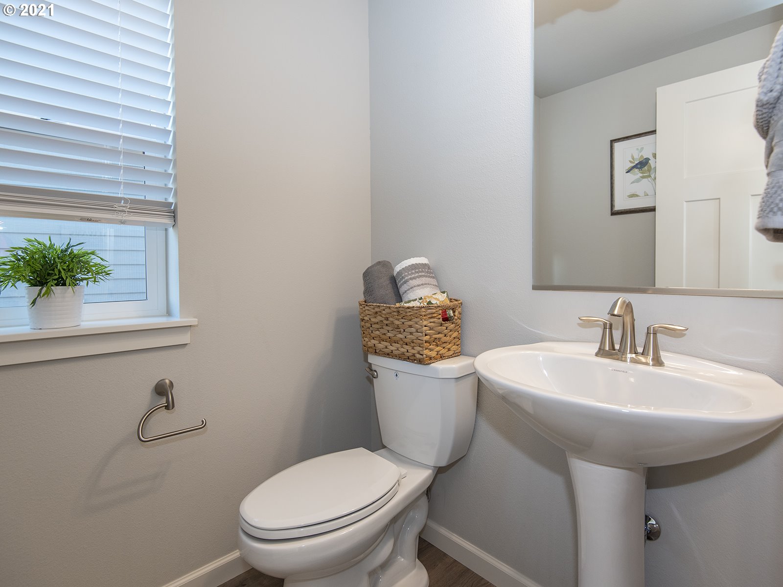 3800 South 43rd Place Ridgefield, WA 98642 - Photo 7 of 28 a bathroom with a toilet sink and mirror
