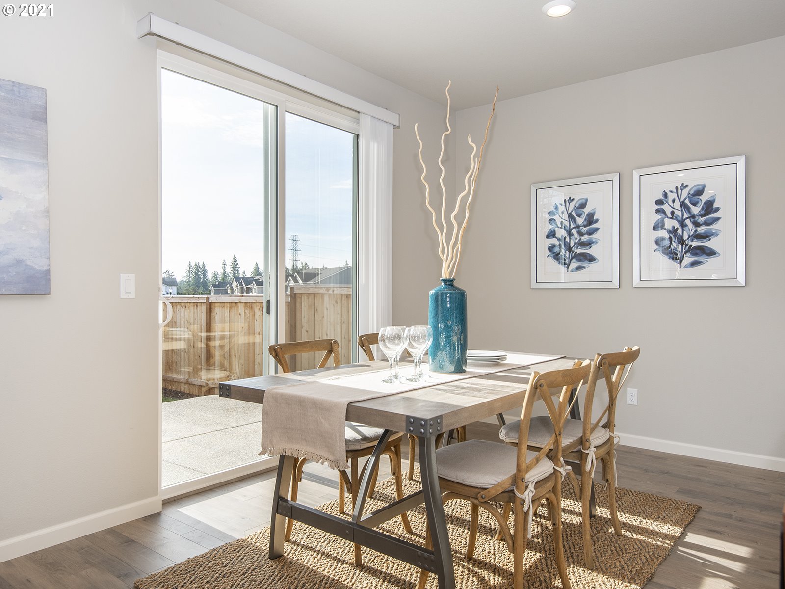 3800 South 43rd Place Ridgefield, WA 98642 - Photo 10 of 28 a view of a dining room with furniture large windows and wooden floor