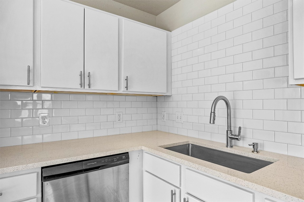 7541 Redrick Drive Austin, TX 78747 - Photo 18 of 40 a kitchen with a sink and cabinets