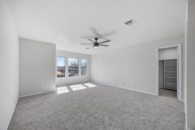 a view of an empty walk in closet