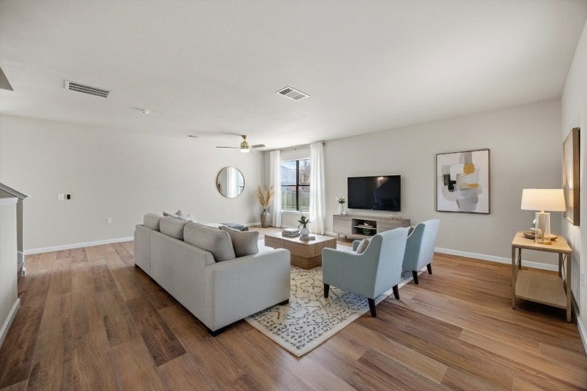 7541 Redrick Drive Austin, TX 78747 - Photo 3 of 40 a living room with furniture and a flat screen tv