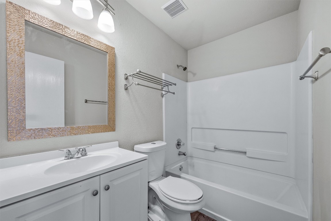7541 Redrick Drive Austin, TX 78747 - Photo 33 of 40 a bathroom with a sink a toilet and shower