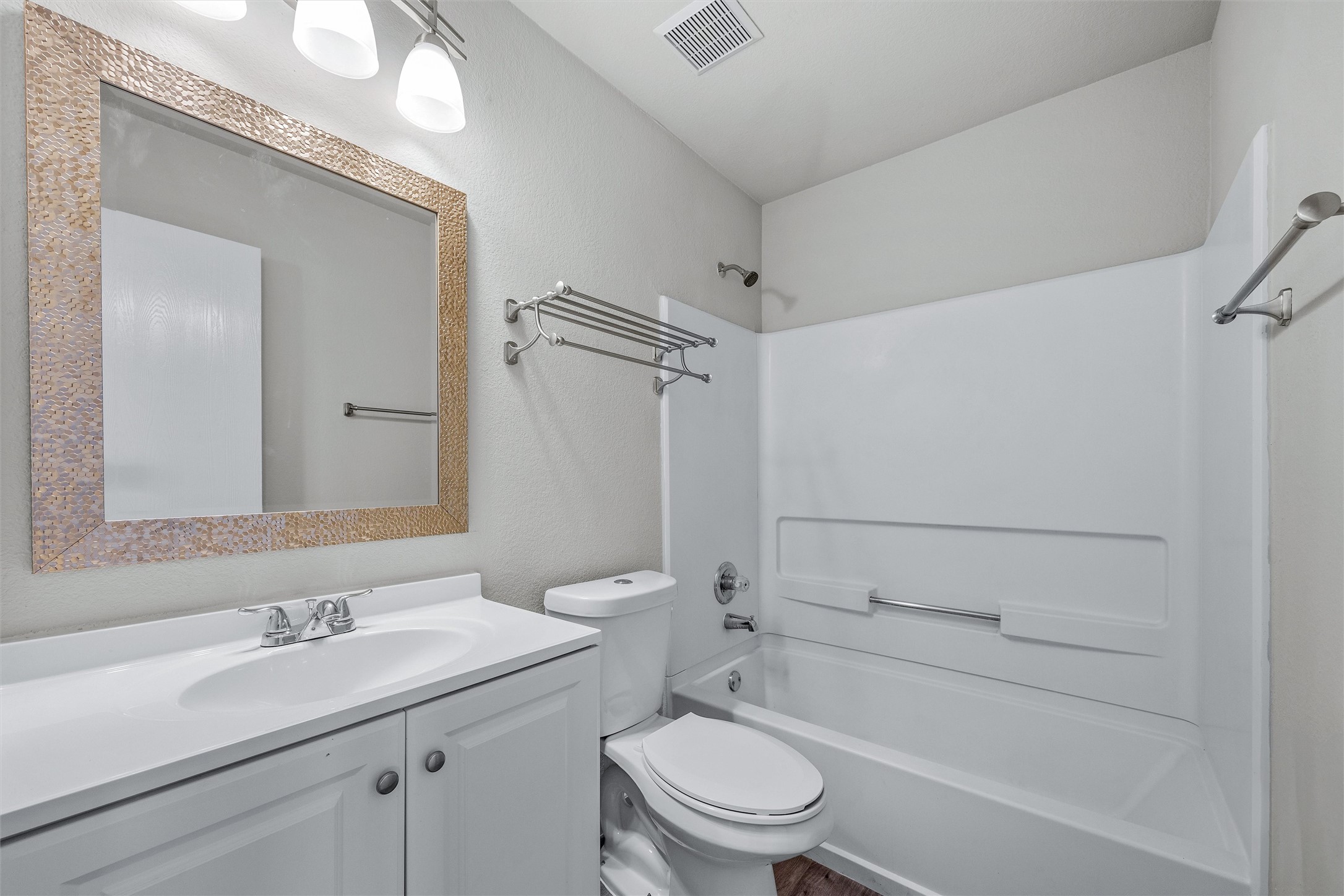 7541 Redrick Drive Austin, TX 78747 - Photo 33 of 40 a bathroom with a sink a toilet and shower