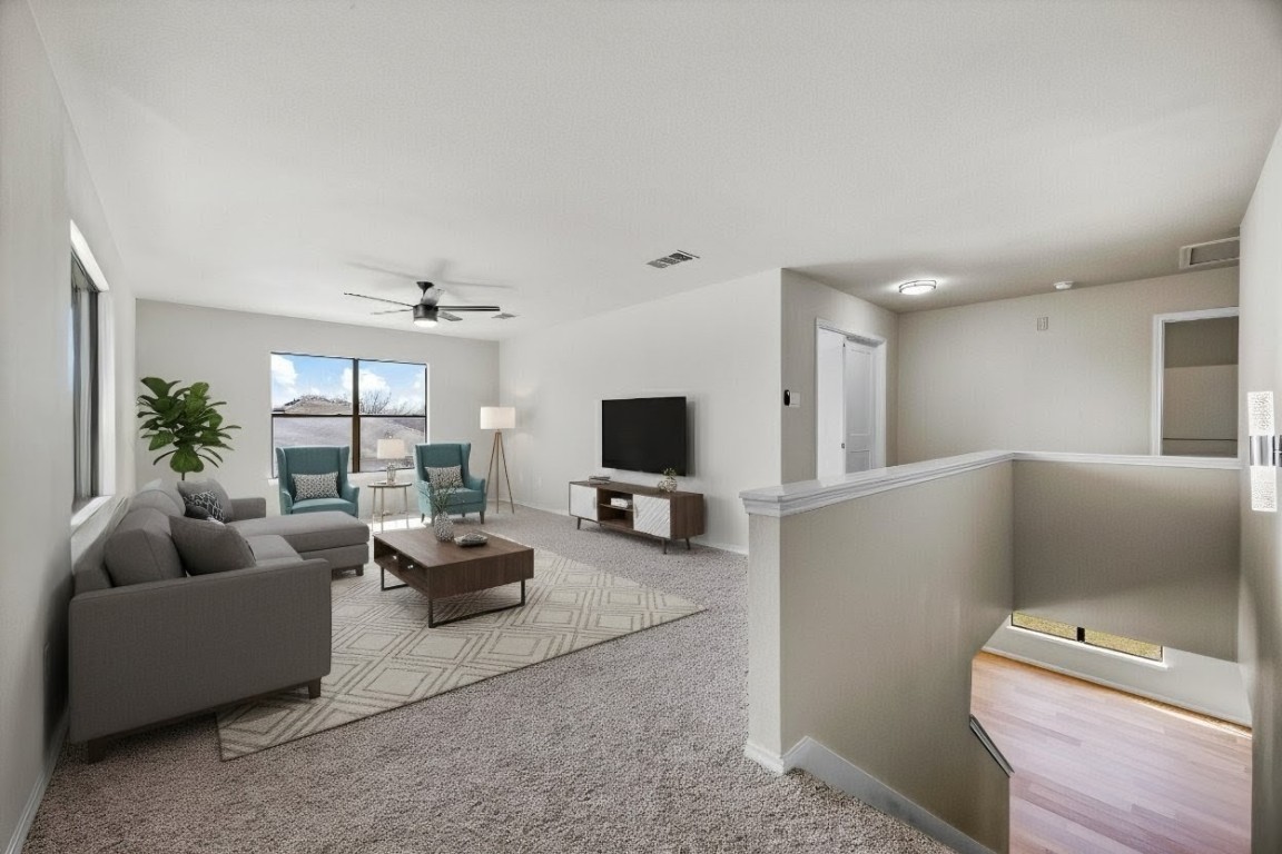 7541 Redrick Drive Austin, TX 78747 - Photo 6 of 40 a living room with furniture and a flat screen tv
