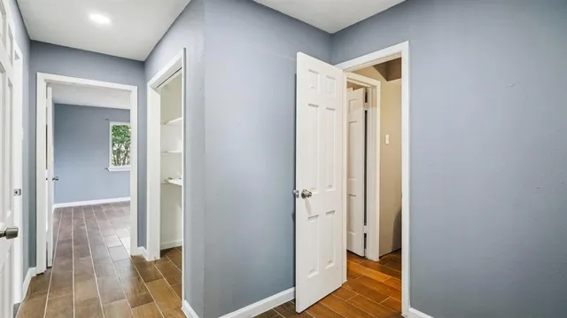 a front view of house with a garden