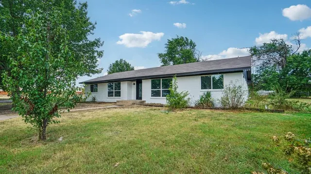 a view of a big yard with a fountain