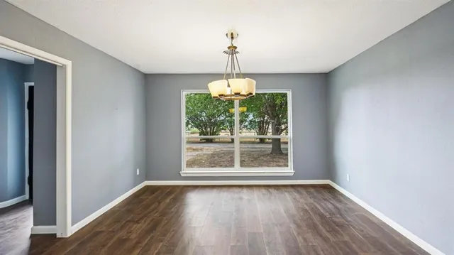 a decorative lighting & window in an empty room