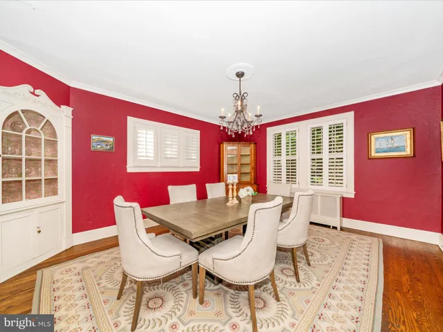 a front view of a house with a yard and a garage