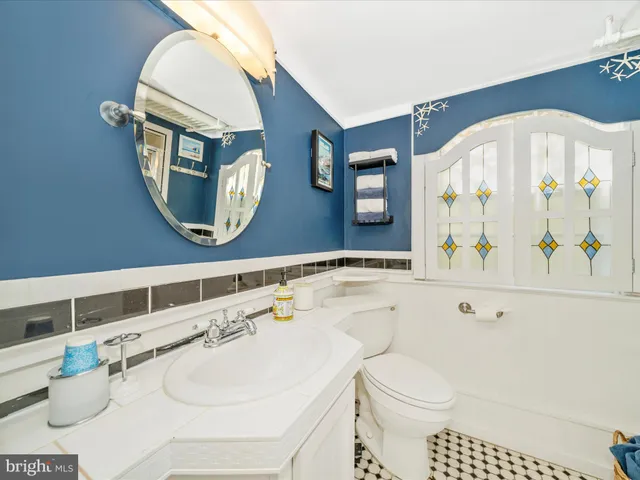 a view of a pathway of a yard with wooden fence