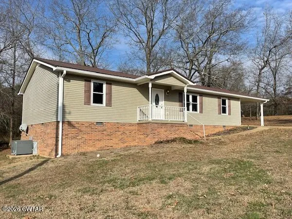 a front view of a house with yard