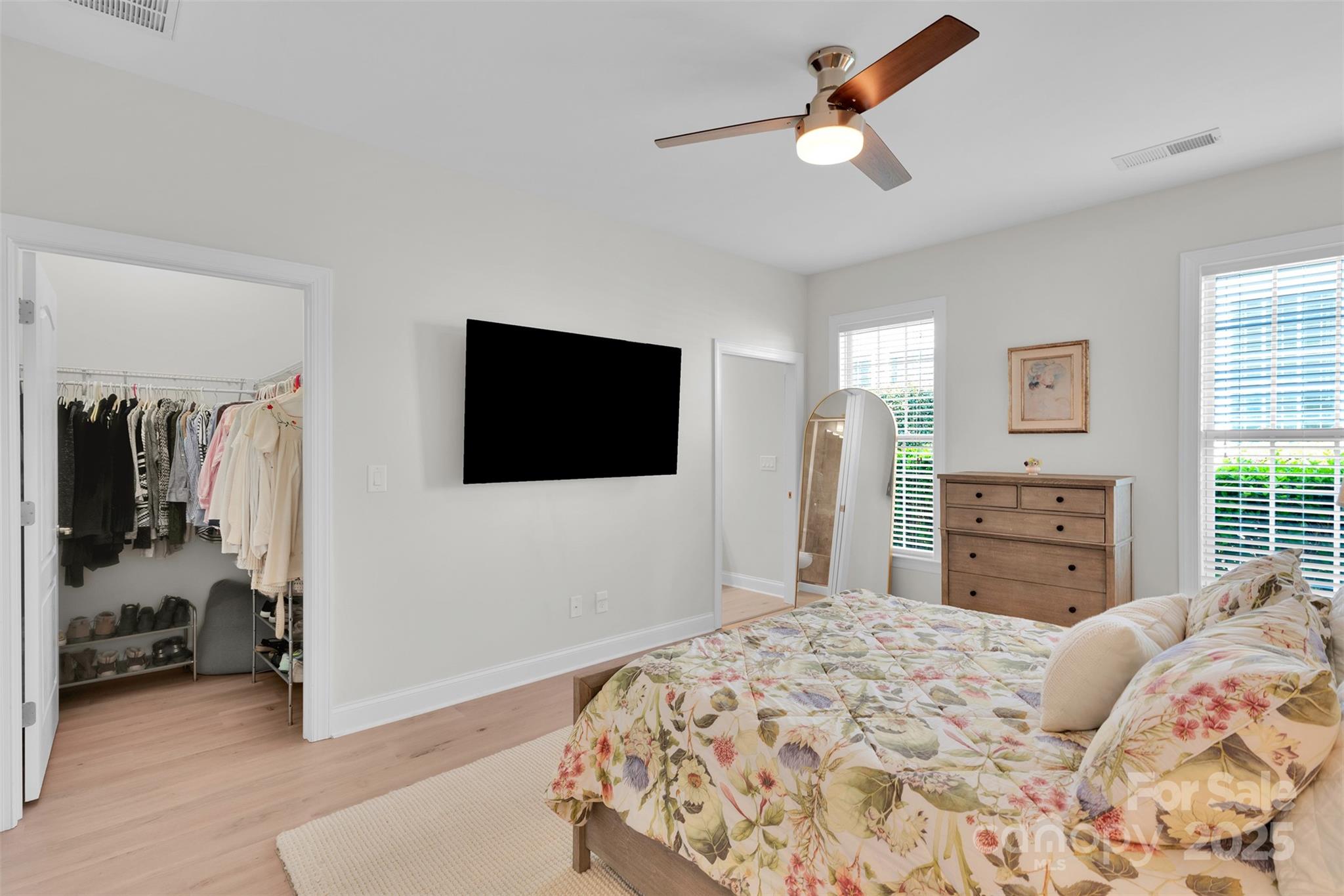 13415 Hazelbrook Lane Cornelius, NC 28031 - Photo 14 of 29 a bedroom with a bed and a television