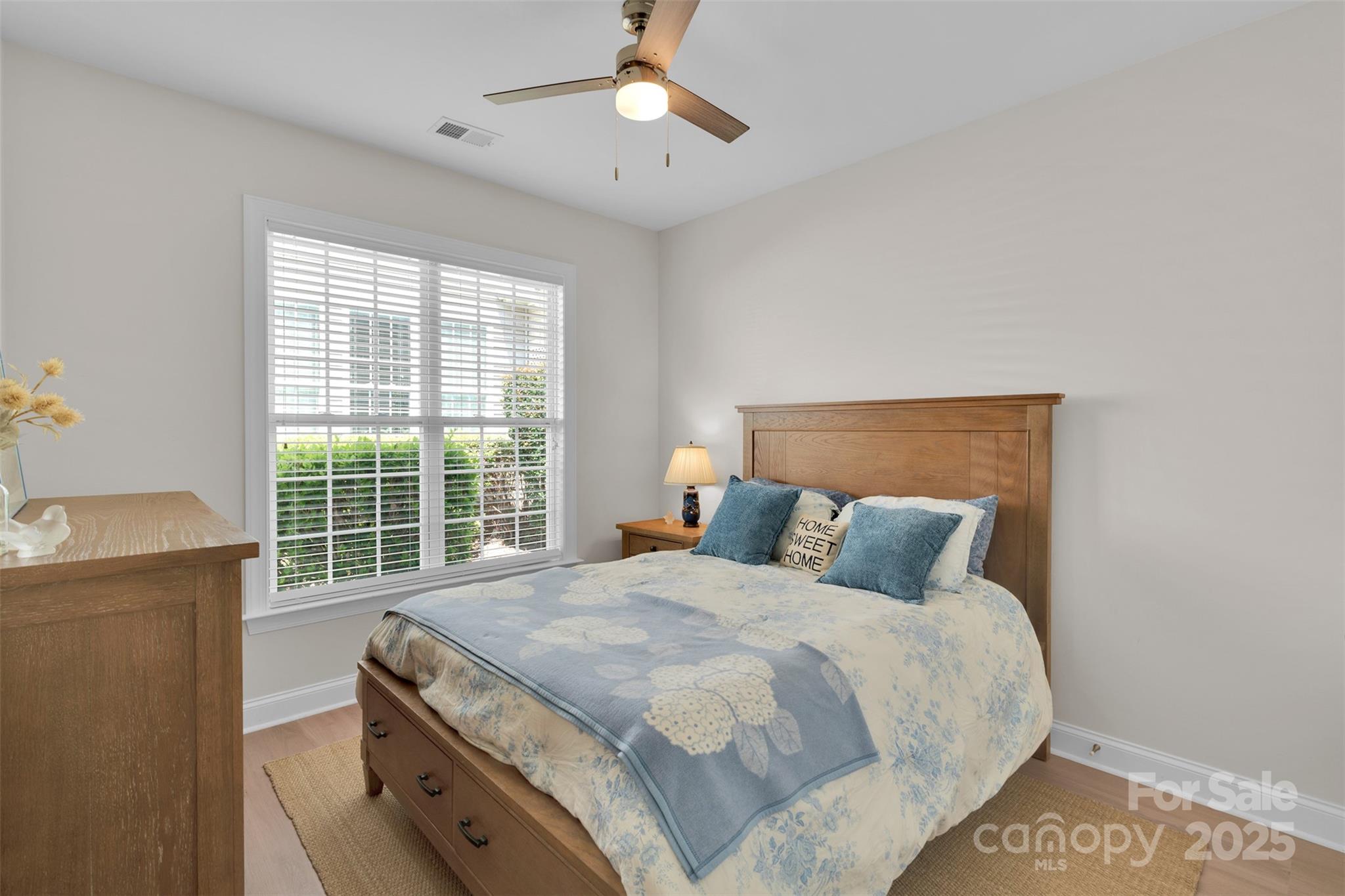 13415 Hazelbrook Lane Cornelius, NC 28031 - Photo 20 of 29 a bedroom with a bed and a window