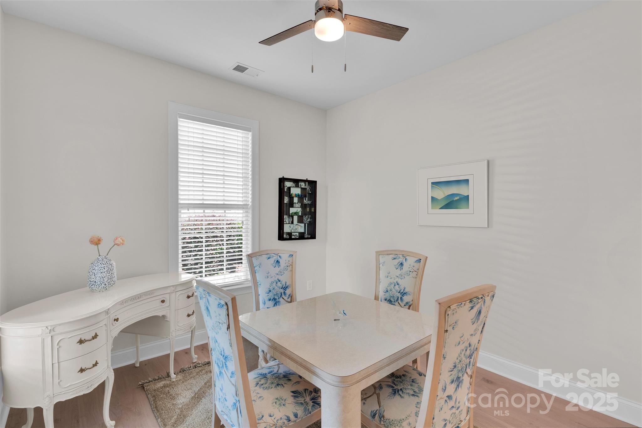 13415 Hazelbrook Lane Cornelius, NC 28031 - Photo 7 of 29 a view of a dining room with furniture and a window