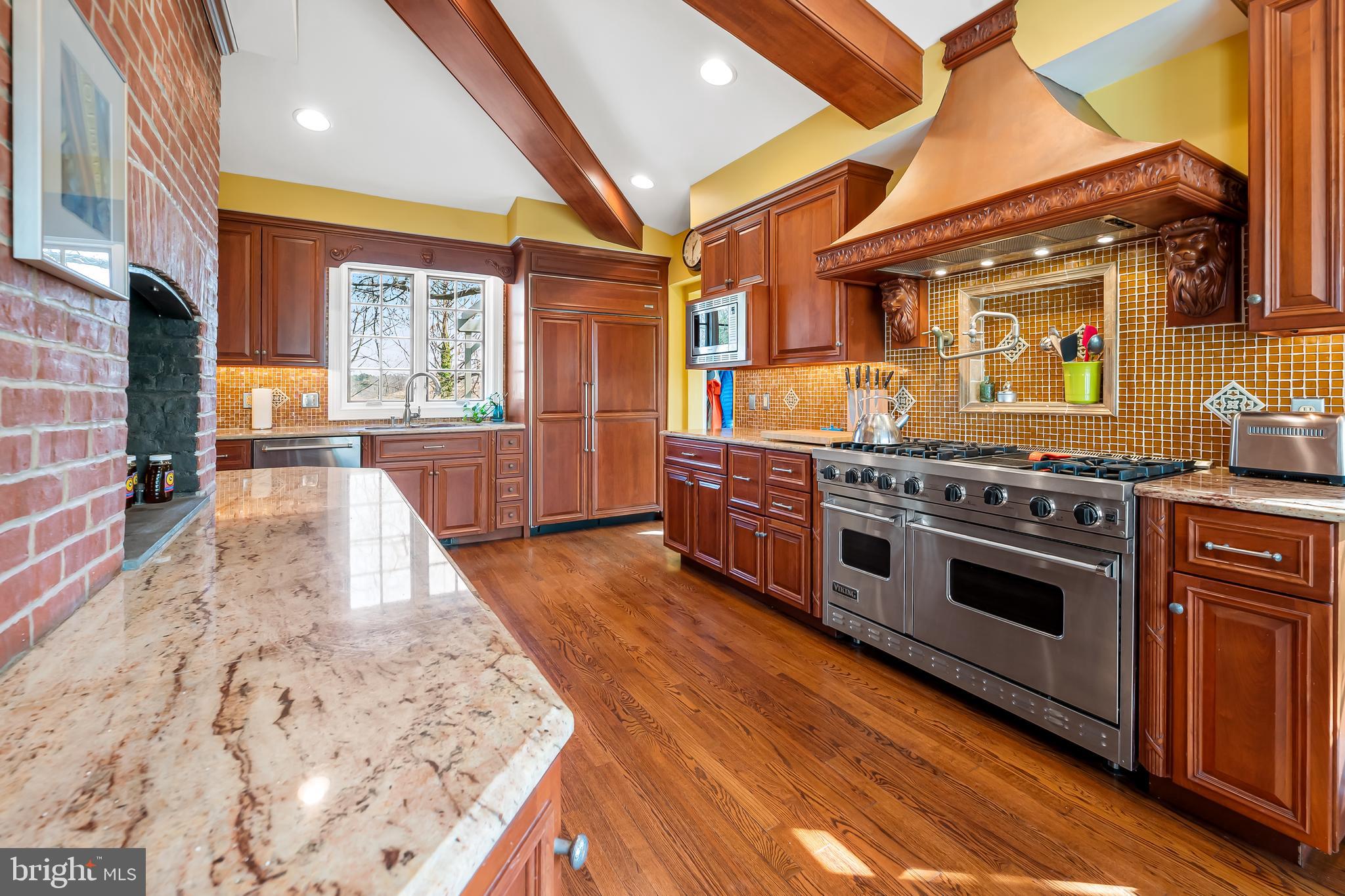 1605 Terrace Road Baltimore, MD 21209 - Photo 16 of 45 a kitchen with stainless steel appliances granite countertop a stove and a wooden floors
