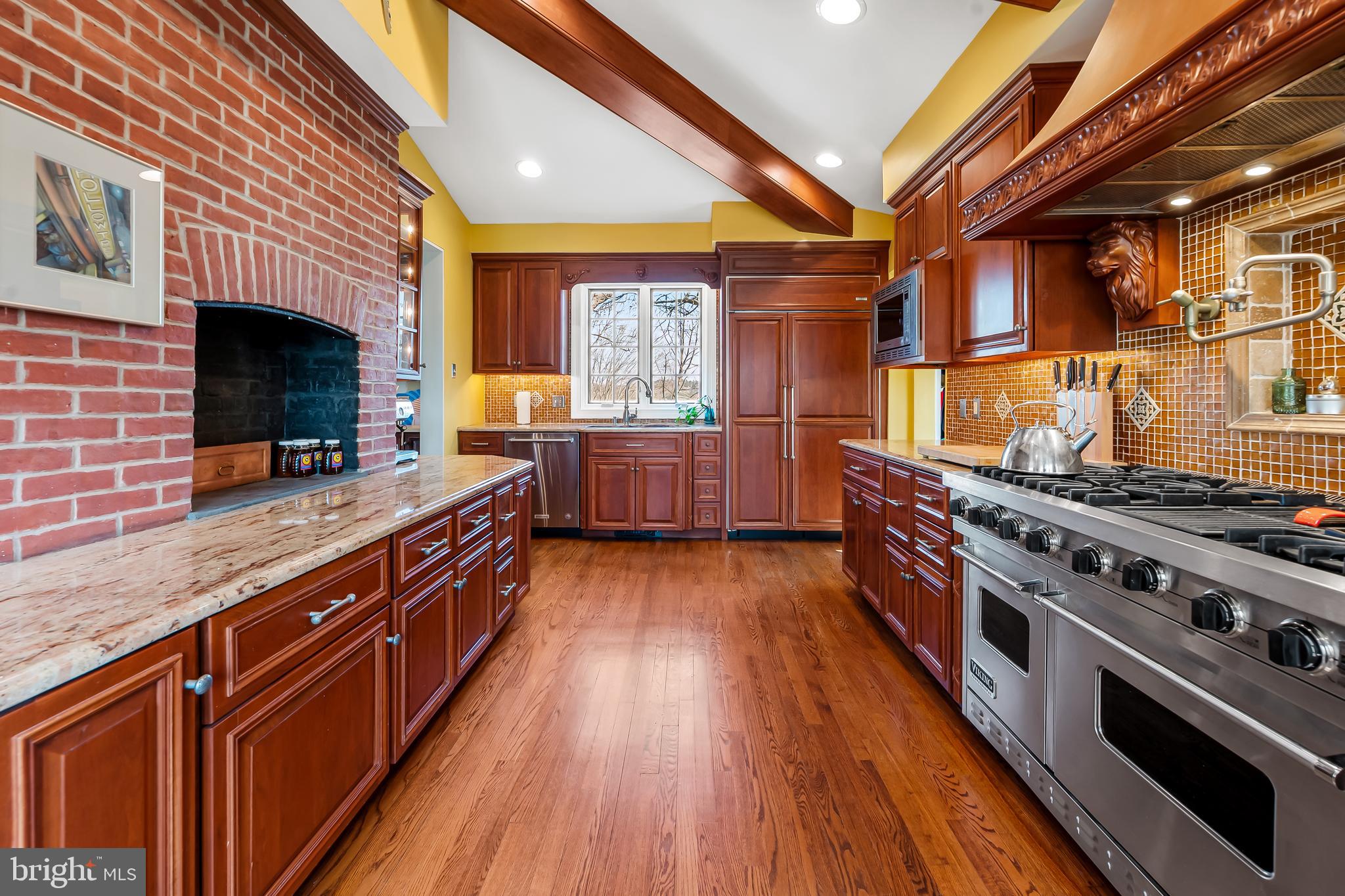 1605 Terrace Road Baltimore, MD 21209 - Photo 20 of 45 a kitchen with wooden floors and a stove