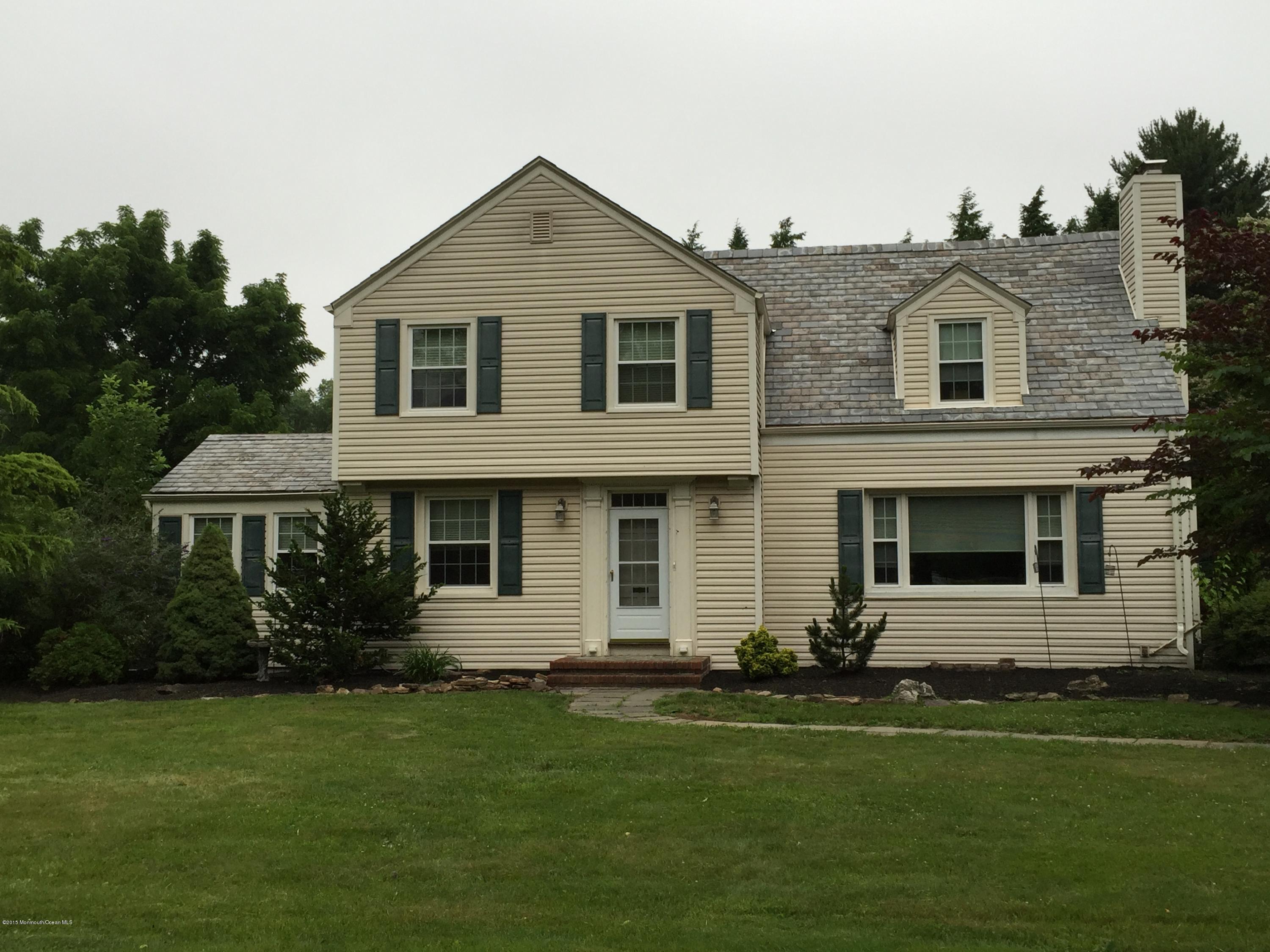 8 Sherwood Road Colonia, NJ 07067 - Photo 1 of 15 a front view of a house with a garden