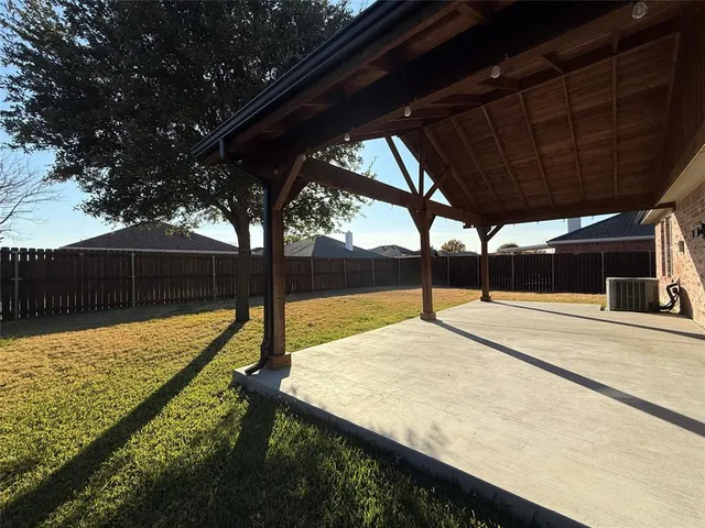 a view of a hallway with a chandelier fan