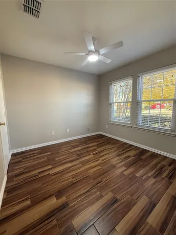 a kitchen with stainless steel appliances a stove top oven a sink a refrigerator and a cabinets