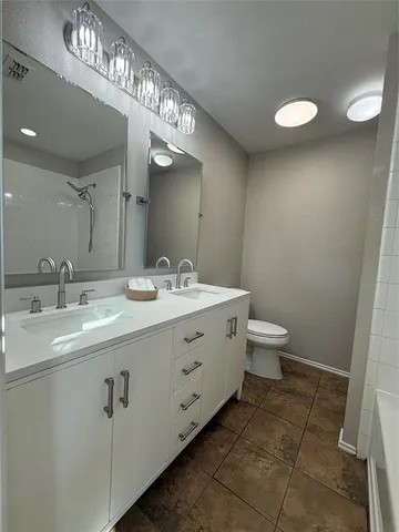 a bathroom with a bathtub and shower