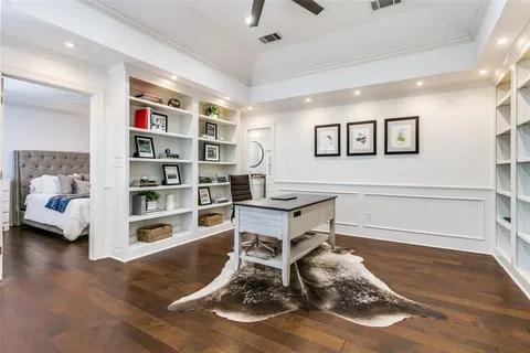 a workspace with furniture and book shelf