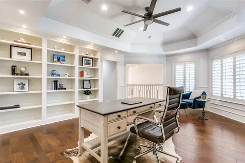 a workspace with furniture window and wooden floor