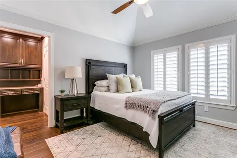 a bedroom with a bed and a fireplace