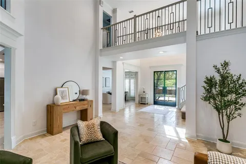 a view of entryway livingroom and hall with wooden floor