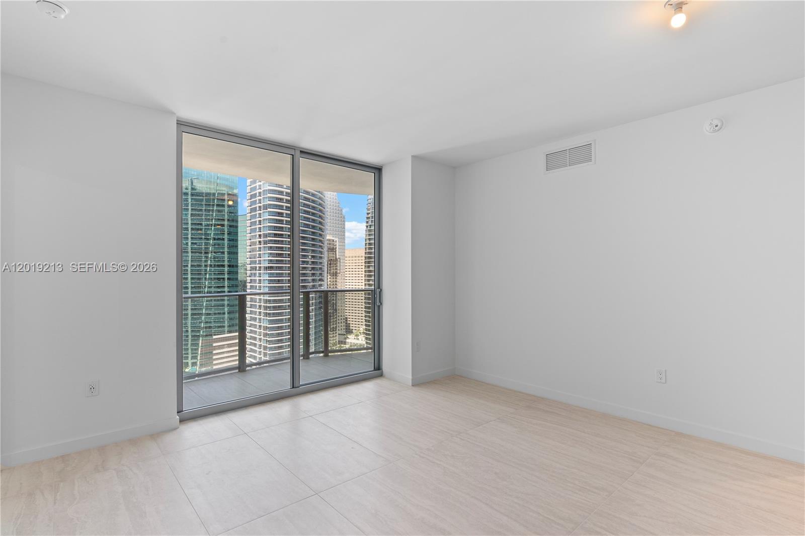 77 Southeast 5th, Unit 3702 Miami, FL 33131 - Photo 24 of 63 an empty room with windows