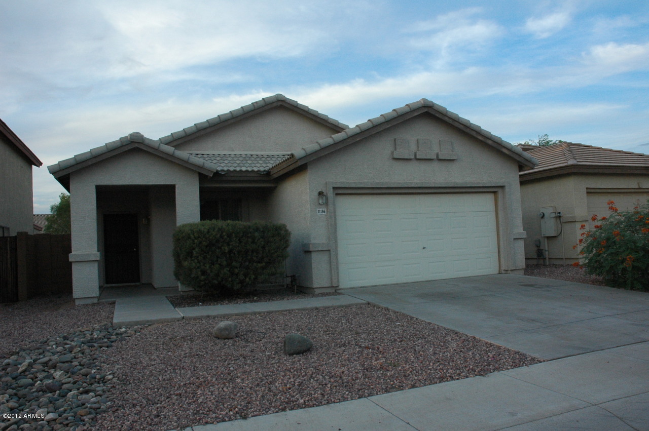 11186 West Berkeley Road Avondale, AZ 85392 - Photo 1 of 15 a view of a house with a yard and garage
