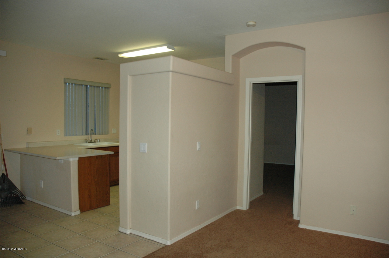 11186 West Berkeley Road Avondale, AZ 85392 - Photo 3 of 15 a bathroom with a sink and a mirror