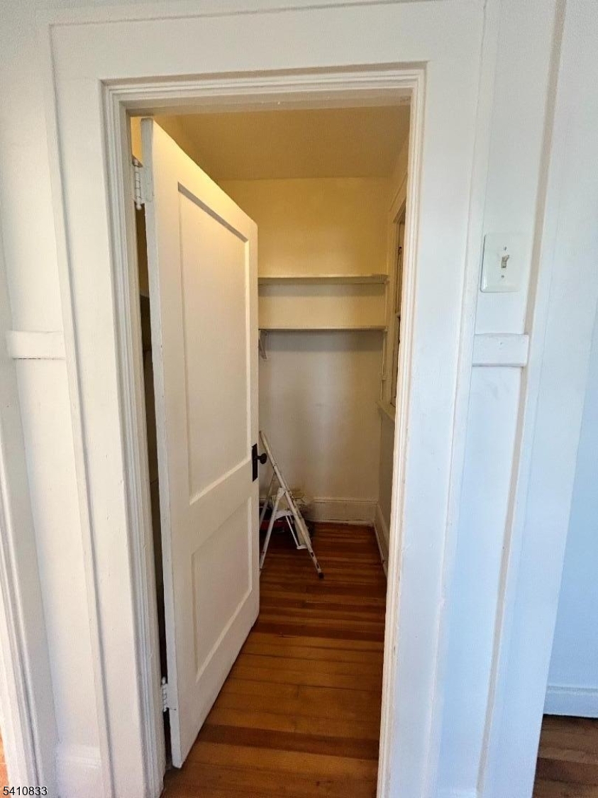 29 Adams Street, Unit 2 Irvington, NJ 07111 - Photo 12 of 14 a view of a hallway with wooden floor and staircase