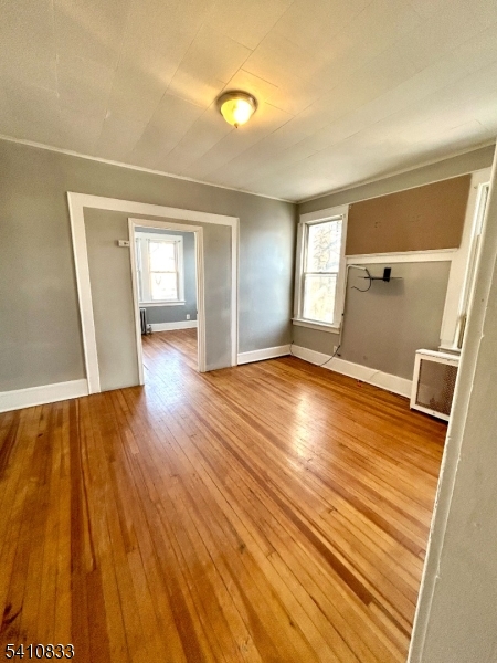 29 Adams Street, Unit 2 Irvington, NJ 07111 - Photo 3 of 14 a view of a room with wooden floor and staircase