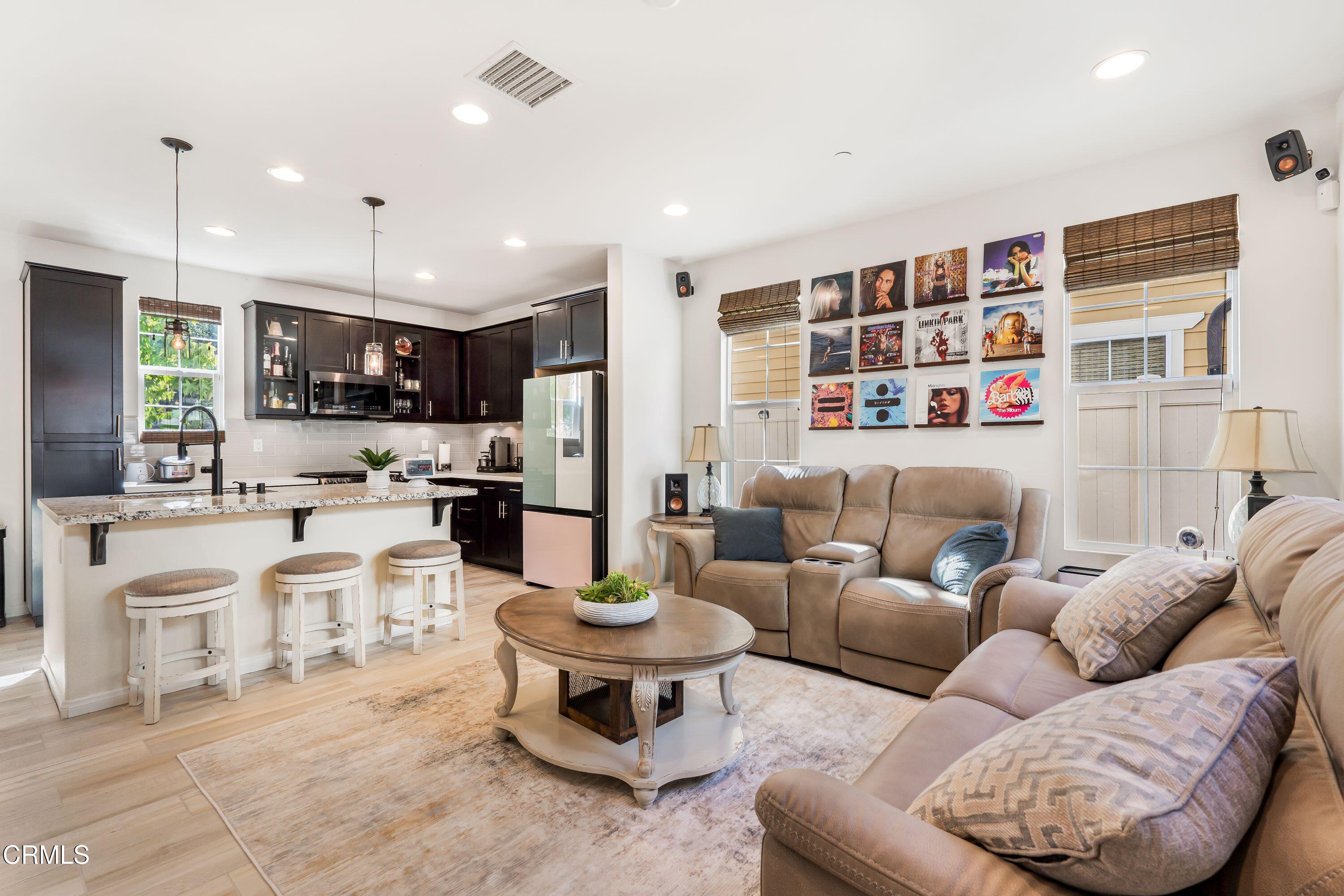 241 Stonegate Road Camarillo, CA 93010 - Photo 12 of 33 a living room with furniture kitchen view and a large window
