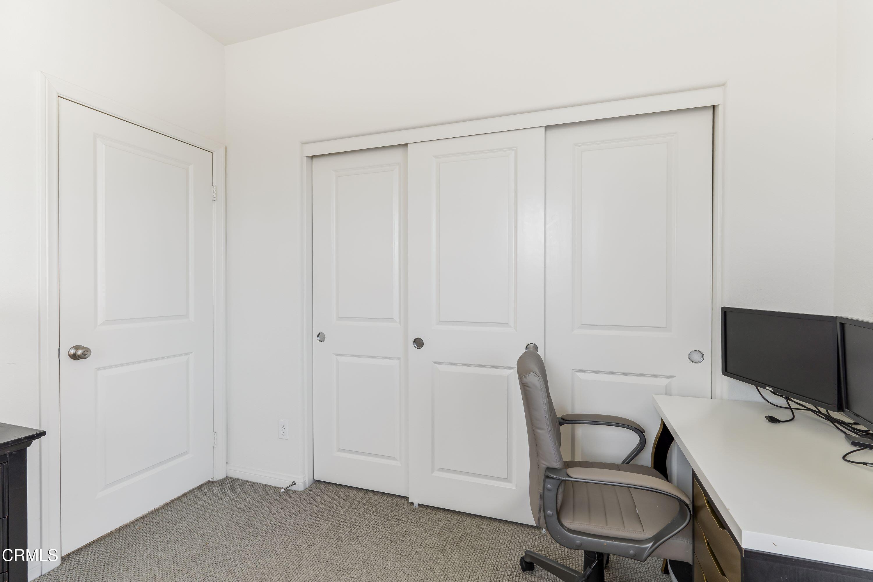 241 Stonegate Road Camarillo, CA 93010 - Photo 19 of 33 a workspace with a wooden floor and a chair