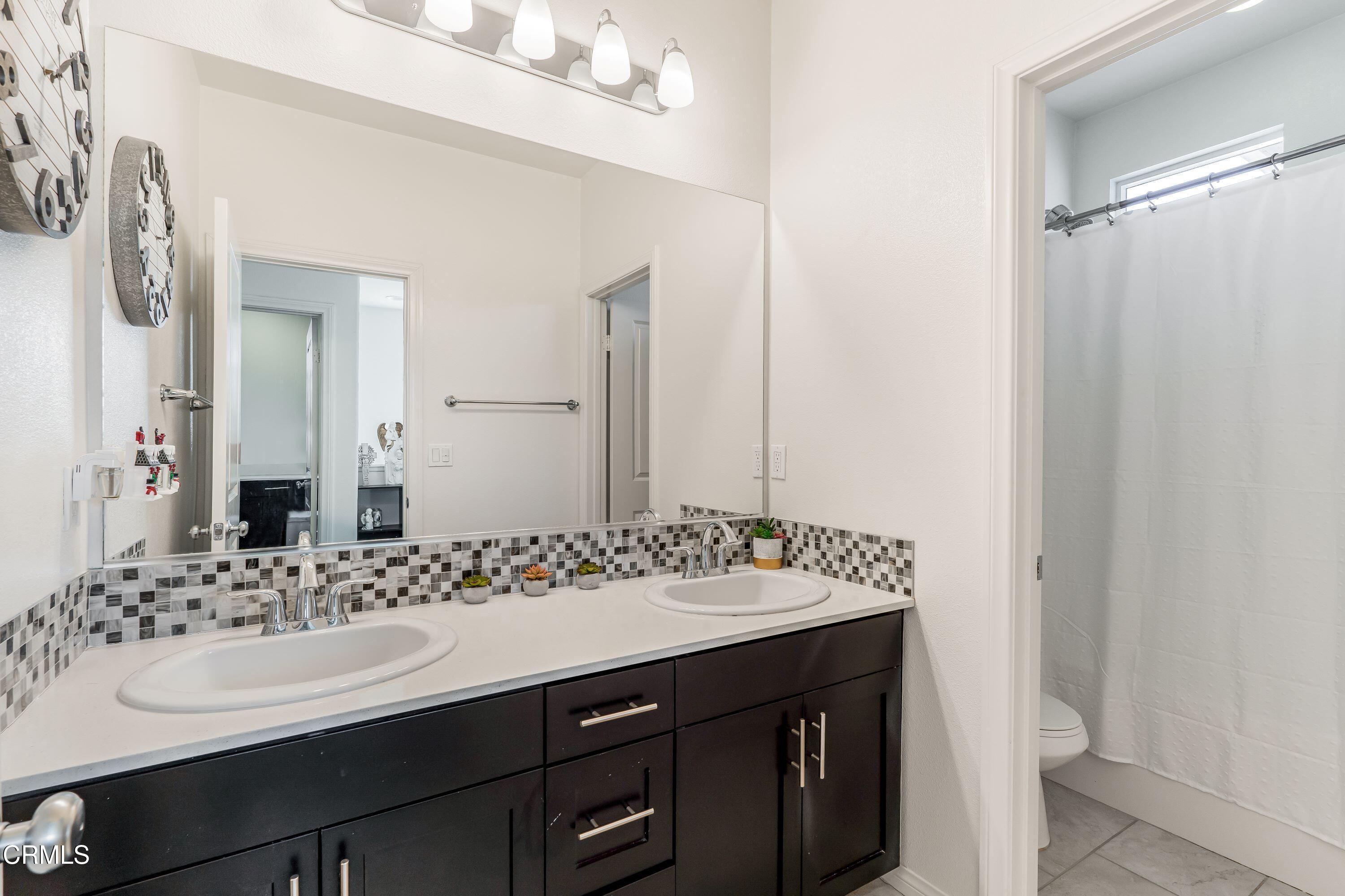 241 Stonegate Road Camarillo, CA 93010 - Photo 20 of 33 a bathroom with a sink and a mirror
