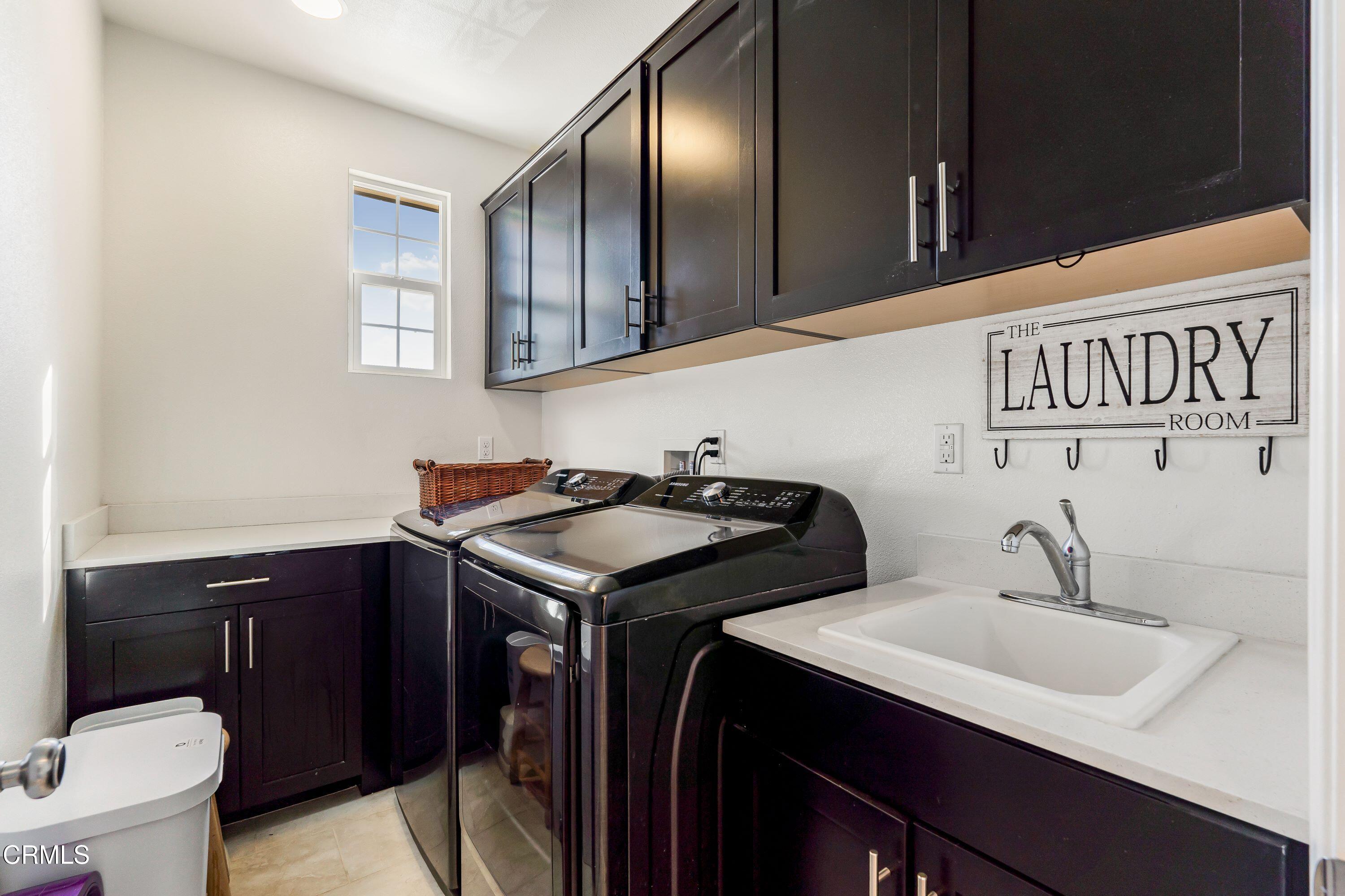 241 Stonegate Road Camarillo, CA 93010 - Photo 26 of 33 a kitchen with a sink and cabinets