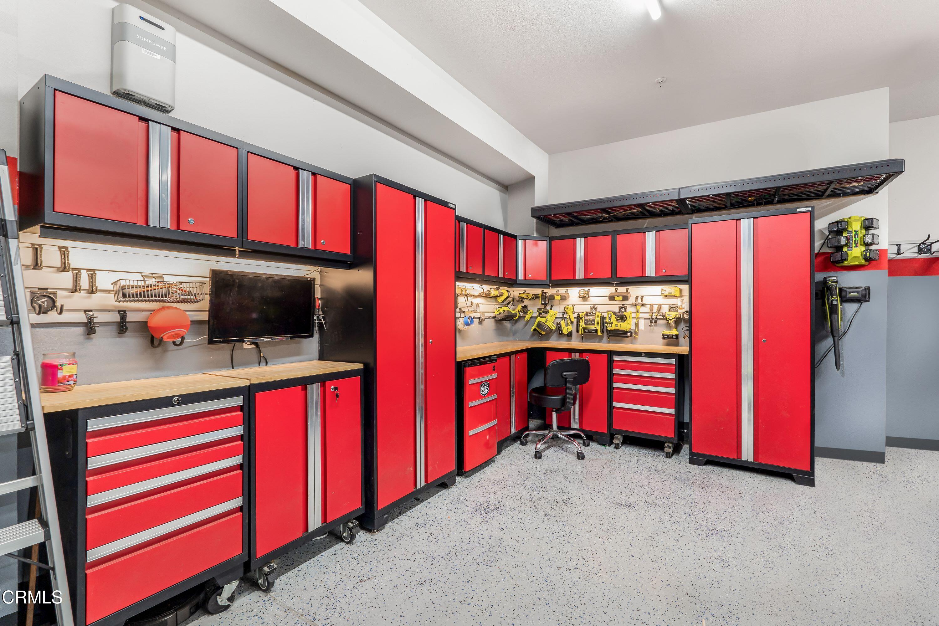 241 Stonegate Road Camarillo, CA 93010 - Photo 28 of 33 a kitchen with red cabinets and window
