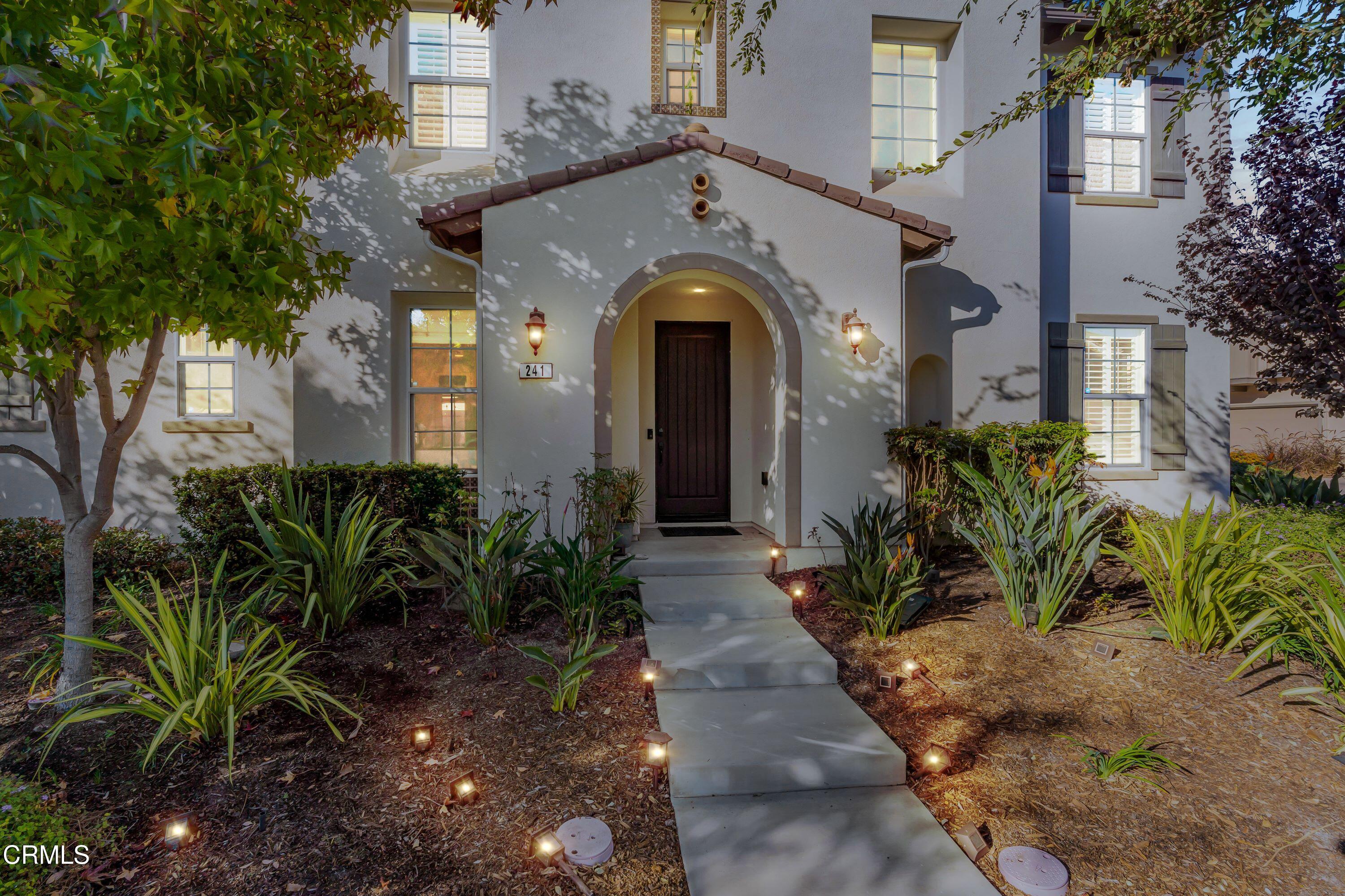 241 Stonegate Road Camarillo, CA 93010 - Photo 3 of 33 a front view of a house with a garden