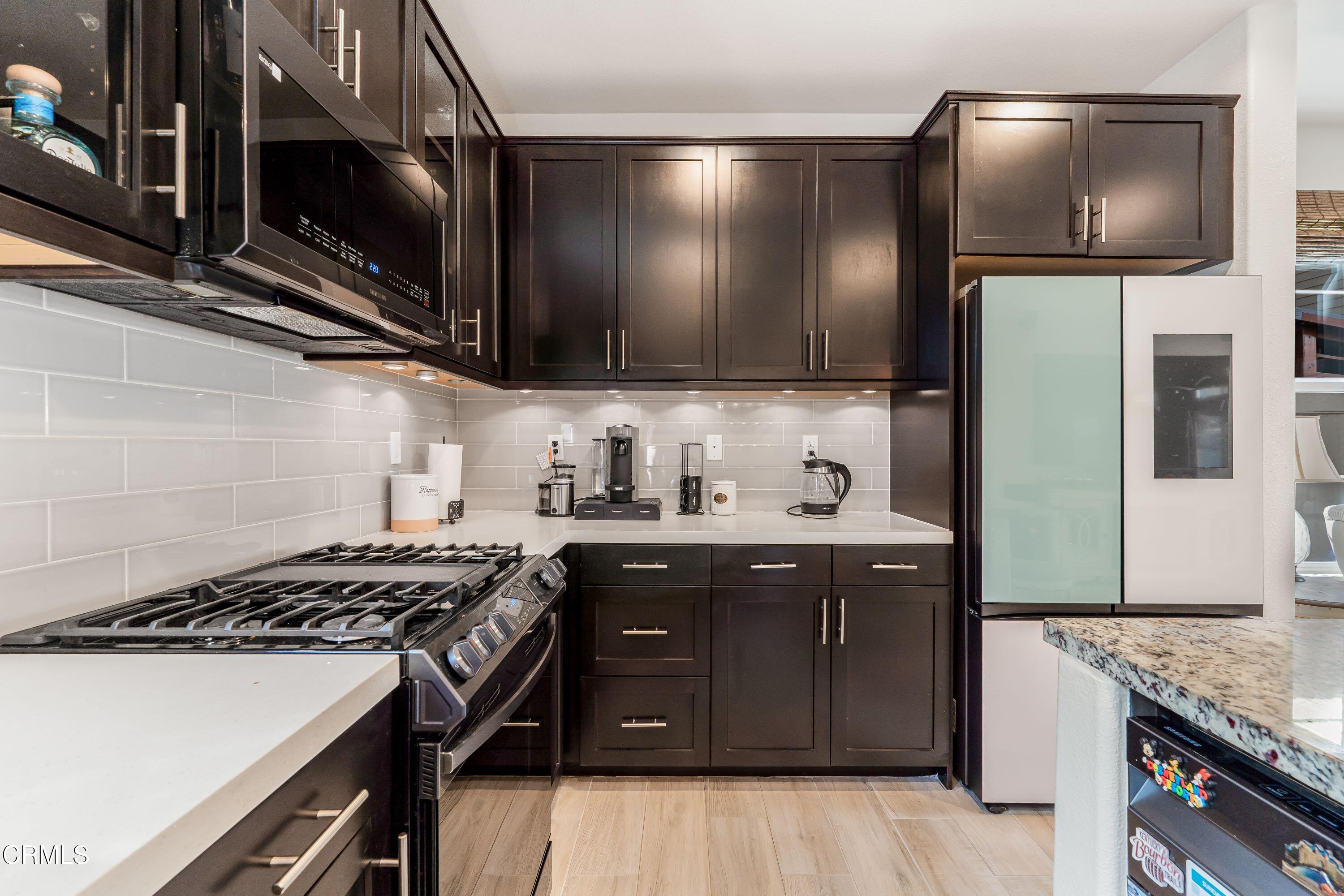 241 Stonegate Road Camarillo, CA 93010 - Photo 10 of 33 a kitchen with a stove and a microwave