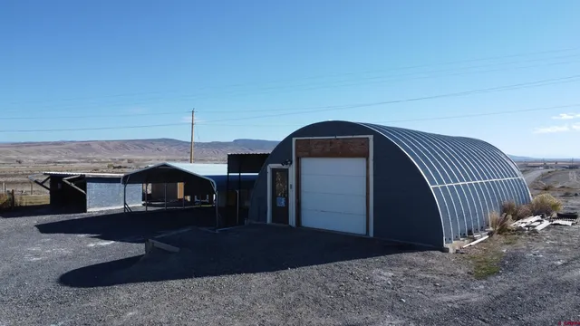 a view of backyard with tub