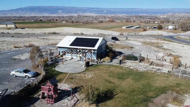 a view of a balcony with couches and wooden floor